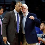 Ime Udoka with Spurs coach Gregg Popovich.