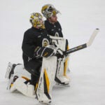 Bruins goaltender Jeremy Swayman (1), pictured with Providence Bruin call up Brandon Bussiwas, on the ice for the morning skate prior to tonight’s Game 3 of the Stanley Cup Playoffs on April 21, 2023 at FLA Live Arena in Sunrise, FL.