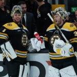 Boston Bruins goaltender Jeremy Swayman (1) and Boston Bruins goaltender Linus Ullmark (35) share a laugh during the pre game warmups. The Boston Bruins host the Arizona Coyotes in the season home opener on October 15, 2022 at TD Garden in Boston, MA.