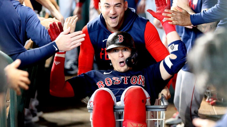 Masataka Yoshida of the Boston Red Sox walks back to the dugout