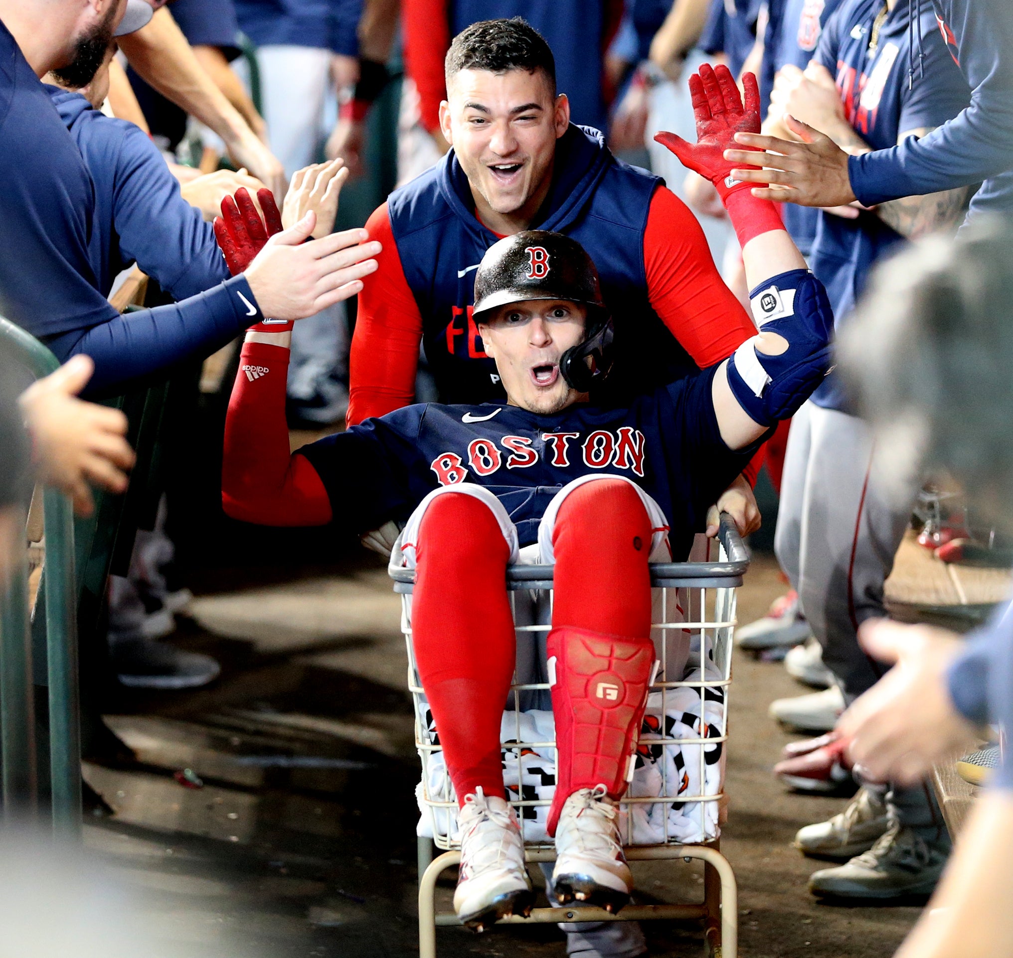Jose Iglesias pushes Kiké Hernandez in the laundry cart following his solo home run in the fourth inning. Boston Red Sox at Houston Astros, Game 2 of the ALCS on Saturday, Oct. 16, 2021 at Minute Maid Park in Houston, Texas.