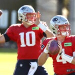 The New England Patriots held practice on the Gillette Stadium practice field Wednesday afternoon. Quarterbacks Mac Jones(left) and Bailey Zappe fire passes during a drill.