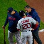 Red Sox infielder Yu Chang is walked off the field following an injury to his hand.