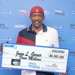 Jovan Garner smiles with his prize check.