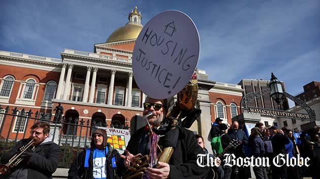Kirk Israel, of Boston Area Brigade of Activist Musicians, played his tuba during a March rally outside the State House urging state officials "to face the housing crisis head-on."