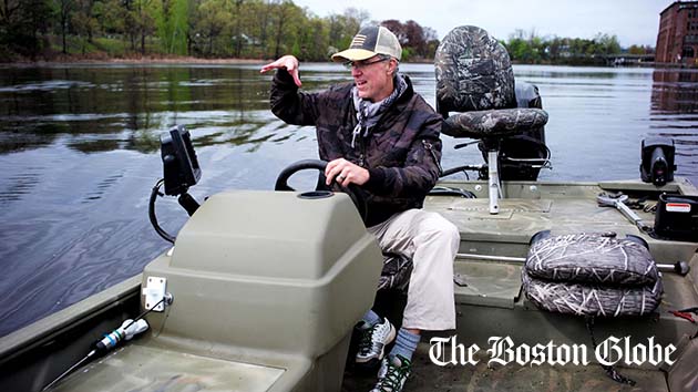 Amateur fisherman Jim Thames uses a fish-finding sonar system to look for bass in the Charles River.