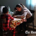 Vicky, who arrived recently from Peru, helped her son with his English homework inside the family’s rented two-bedroom apartment in Chelsea.