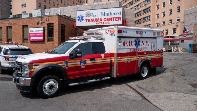 An ambulance leaves the entrance to Elmhurst Hospital Center, which witnessed some of the highest number of Covid-19 cases and deaths on May 11, 2023 in the Queens borough of New York City.