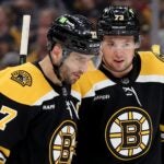 Patrice Bergeron #37 and Charlie McAvoy #73 of the Boston Bruins talk against the Florida Panthers during the second period in Game Five of the First Round of the 2023 Stanley Cup Playoffs at TD Garden on April 26, 2023 in Boston, Massachusetts.