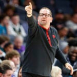 Toronto Raptors head coach Nick Nurse directs his team during the first half of an NBA basketball game against the Charlotte Hornets.