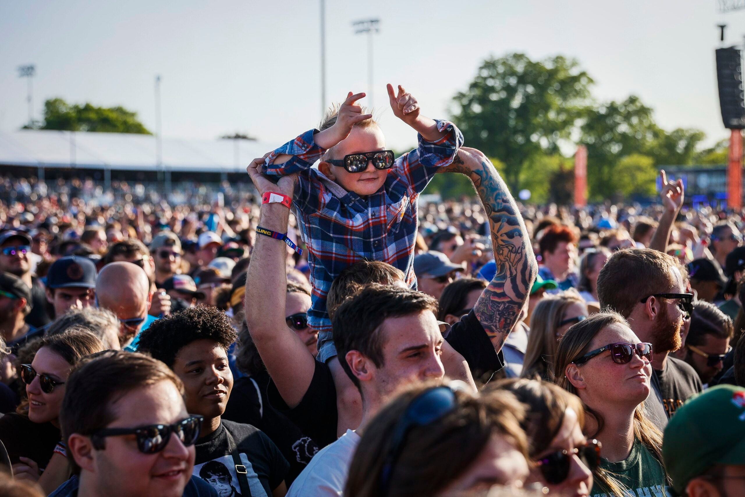 A young fan watches The Dropkick Murphys at Boston Calling 2023 on Friday.