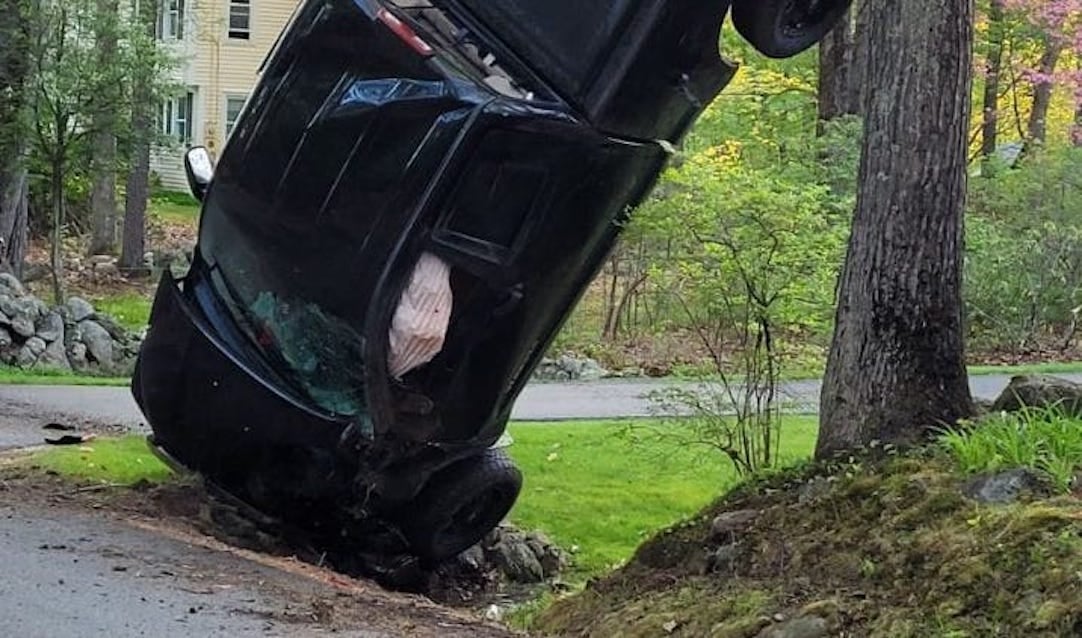 Driver walks away uninjured from crash that left truck upside down against a tree in n. H.
