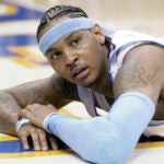 Denver Nuggets forward Carmelo Anthony looks up from the floor after getting called for a foul in the fourth quarter of game 3 of the NBA Western Conference playoff series against the San Antonio Spurs in Denver on April 28, 2007.