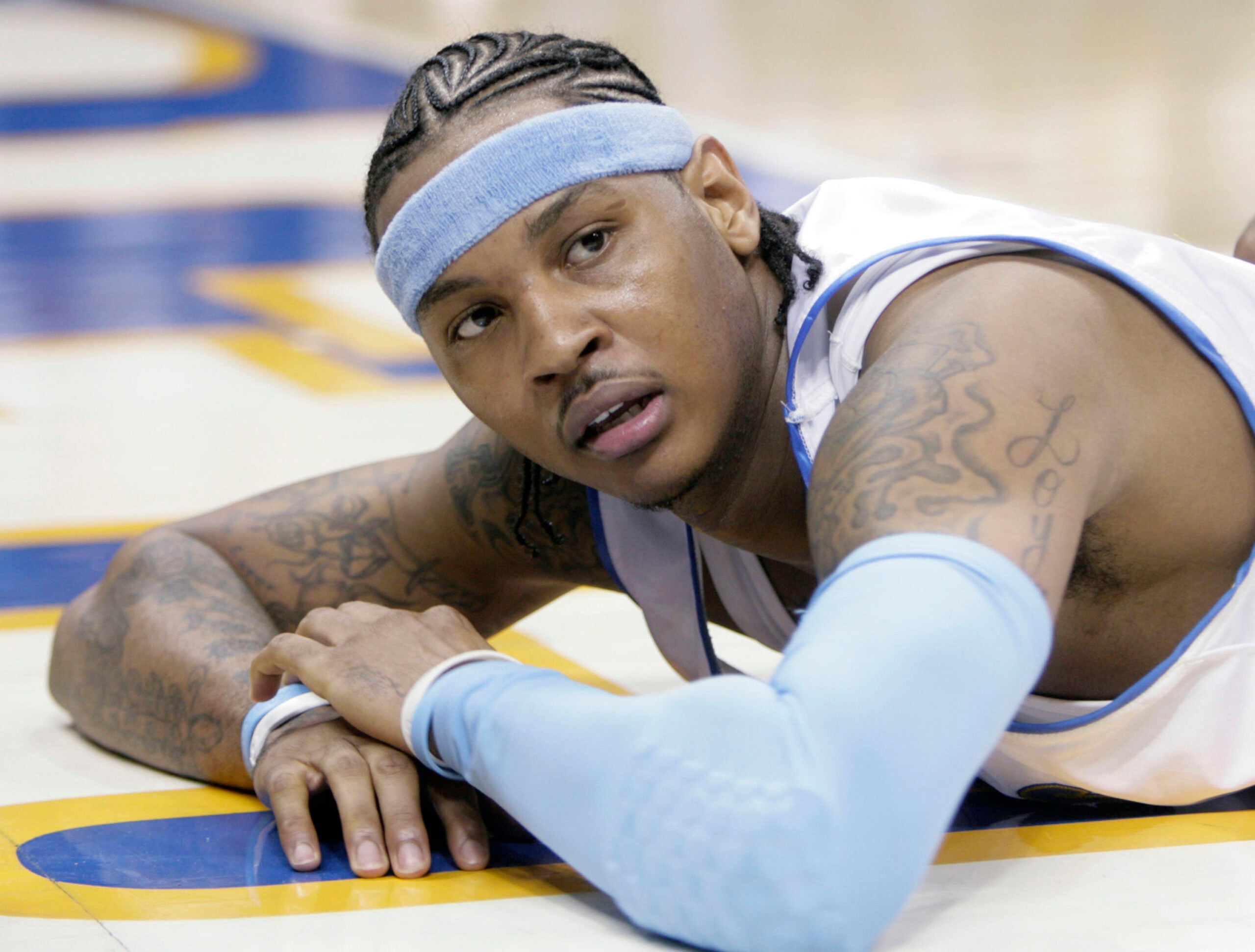 Denver Nuggets forward Carmelo Anthony looks up from the floor after getting called for a foul in the fourth quarter of game 3 of the NBA Western Conference playoff series against the San Antonio Spurs in Denver on April 28, 2007.