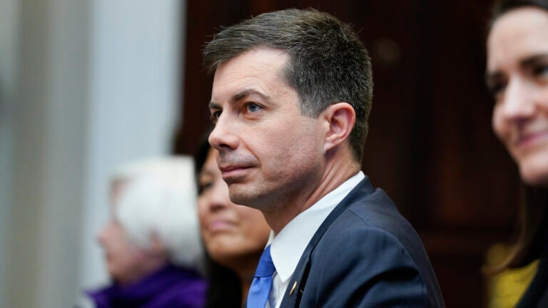 Transportation Secretary Pete Buttigieg attends a meeting with President Joe Biden's "Investing in America Cabinet," in the Roosevelt Room of the White House, Friday, May 5, 2023, in Washington.