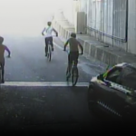 A group of bikers exit a tunnel