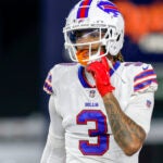 Buffalo Bills safety Damar Hamlin (3) adjusts his chin strap during the second half of an NFL football game against the New England Patriots.