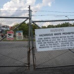 A former trash incinerator that closed earlier in the year is seen through locked gates in Hartford, Connecticut.