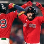 Boston Red Sox's Connor Wong, right, celebrates with Alex Verdugo (99) after his solo home run, which broke a 6-6 tie, during the eighth inning of a baseball game at Fenway Park, Tuesday, May 2, 2023, in Boston.