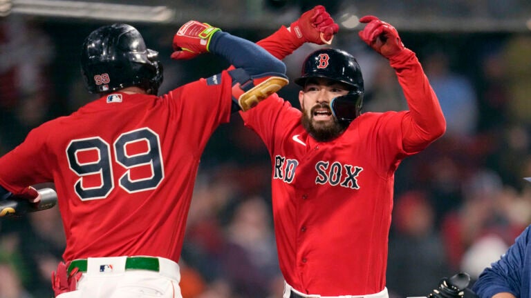 Boston Red Sox's Connor Wong, right, celebrates with Alex Verdugo (99) after his solo home run, which broke a 6-6 tie, during the eighth inning of a baseball game at Fenway Park, Tuesday, May 2, 2023, in Boston.