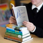 Woman reads "The Bluest Eye" by Toni Morrison