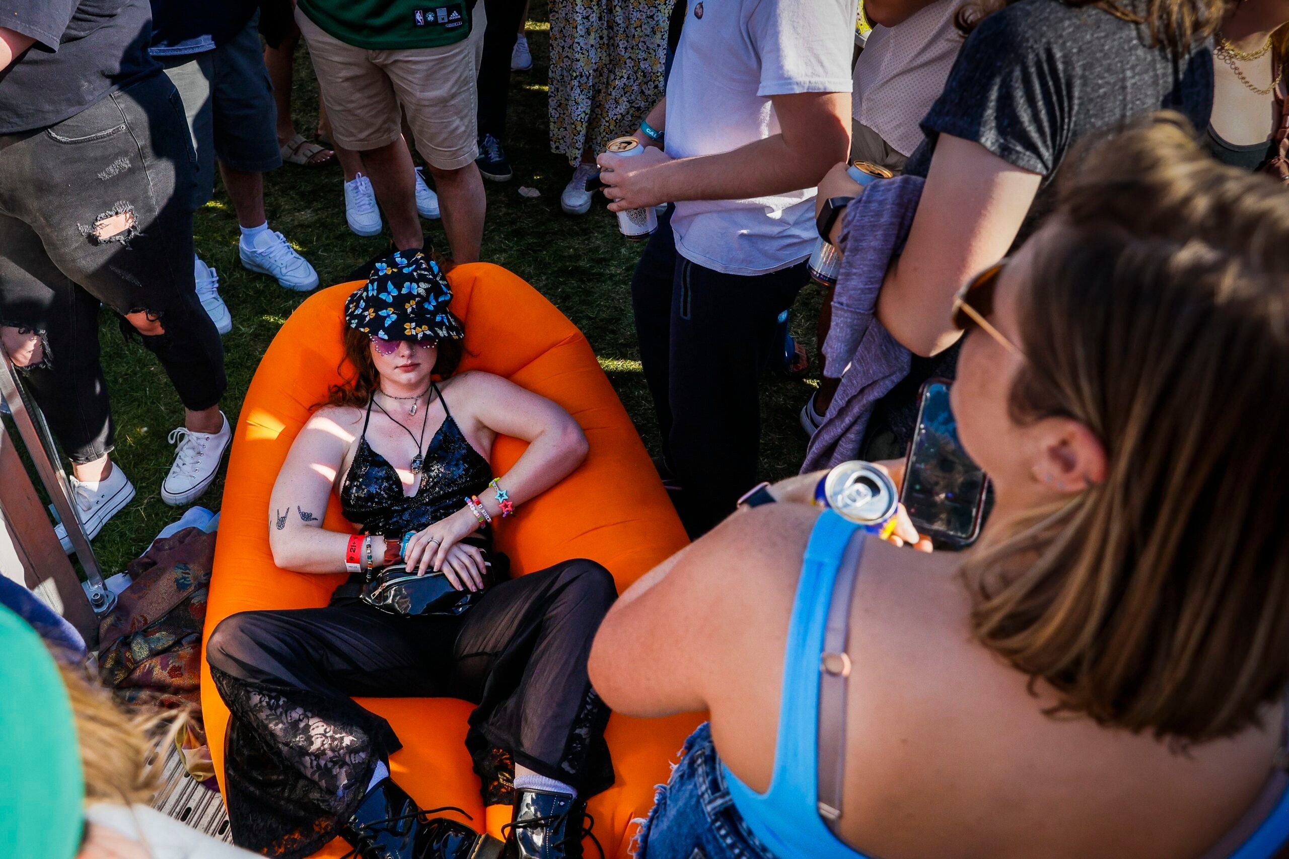 A fan takes a nap at Boston Calling 2023 on Saturday.