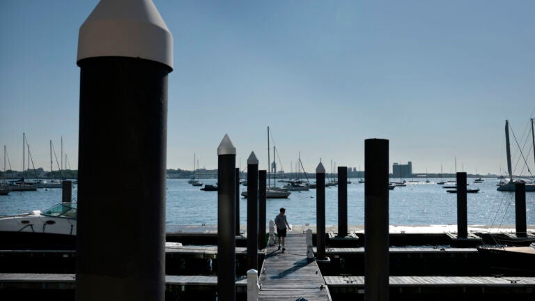 Boston weather , MA - 5/31/2023: John Kiely works on the dock at Rowes Wharf Marina in Boston.