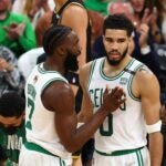 Jaylen Brown #7 and Jayson Tatum #0 of the Boston Celtics talk over a play in the second quarter against the Golden State Warriors during Game Four of the 2022 NBA Finals at TD Garden on June 10, 2022 in Boston, Massachusetts.