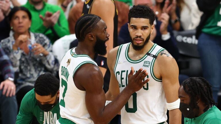 Jaylen Brown #7 and Jayson Tatum #0 of the Boston Celtics talk over a play in the second quarter against the Golden State Warriors during Game Four of the 2022 NBA Finals at TD Garden on June 10, 2022 in Boston, Massachusetts.