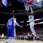 Boston Celtics' Robert Williams III dunks against Philadelphia 76ers' Tobias Harris