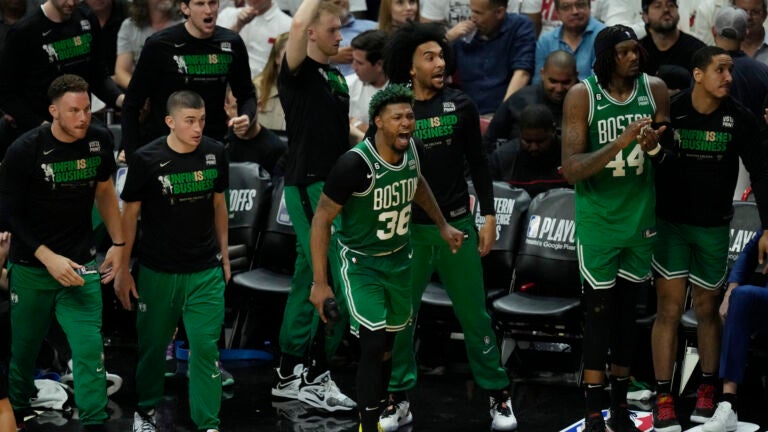 Boston Celtics players cheer during the second half of Game 4 during the NBA basketball playoffs Eastern Conference finals against the Miami Heat, Tuesday, May 23, 2023, in Miami.