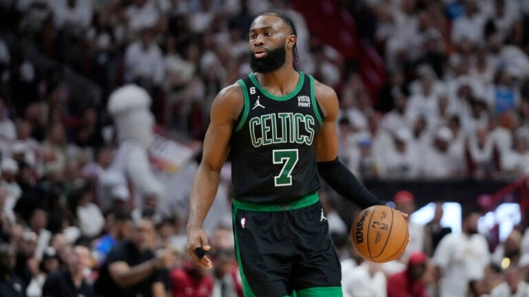 Boston Celtics guard Jaylen Brown (7) dribbles the ball during Game 3 of the NBA basketball playoffs Eastern Conference finals against the Miami Heat, Sunday, May 21, 2023, in Miami.
