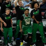 Celtics players cheer during the second half of Game 4.