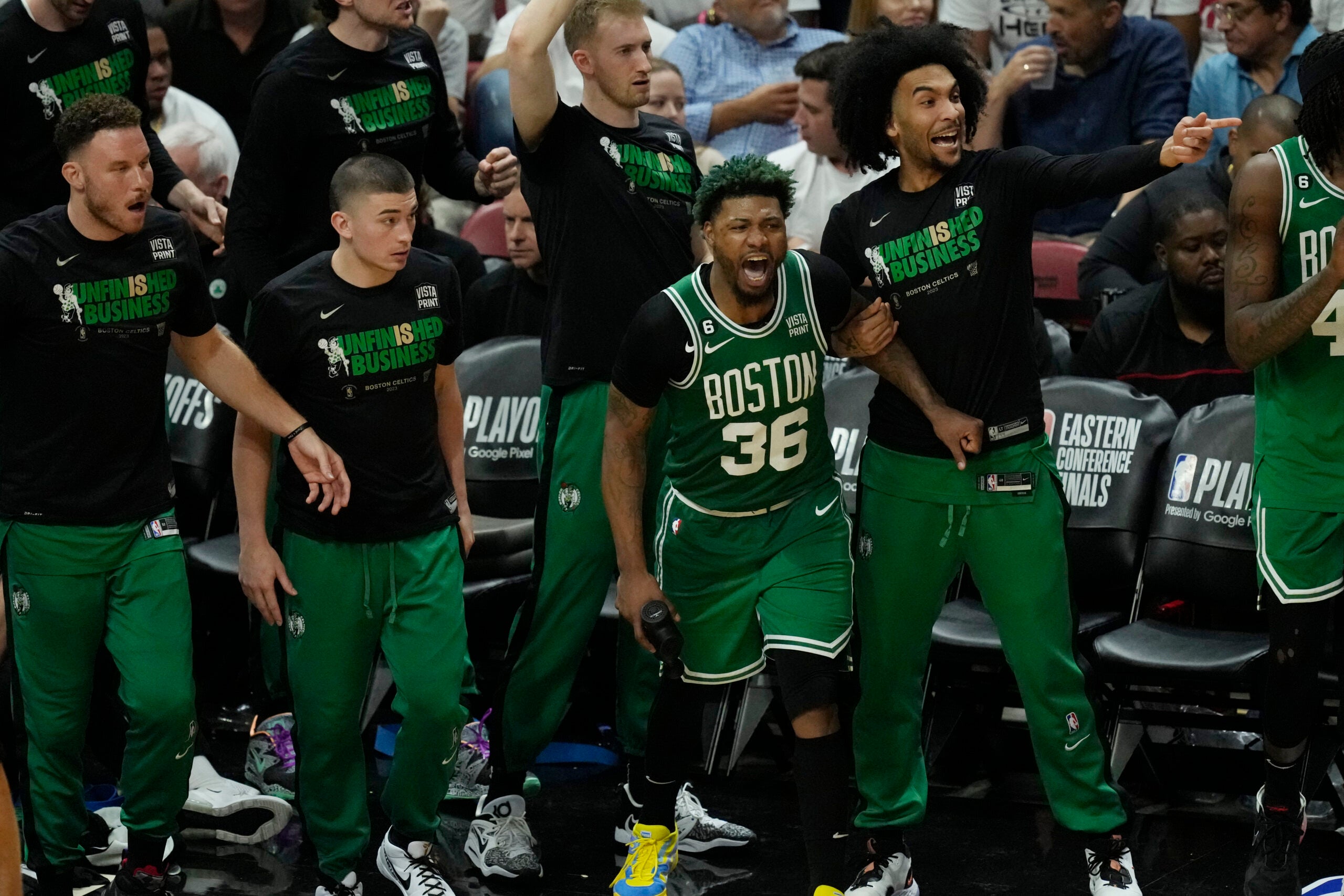Celtics players cheer during the second half of Game 4.