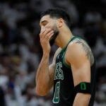 Boston Celtics forward Jayson Tatum (0) reacts during the second half of Game 3 of the NBA basketball playoffs Eastern Conference finals against the Miami Heat, Sunday, May 21, 2023, in Miami.