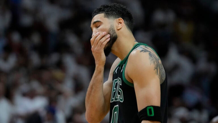 Boston Celtics forward Jayson Tatum (0) reacts during the second half of Game 3 of the NBA basketball playoffs Eastern Conference finals against the Miami Heat, Sunday, May 21, 2023, in Miami.