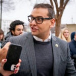 Rep. George Santos, R-N.Y., leaves a House GOP conference meeting on Capitol Hill