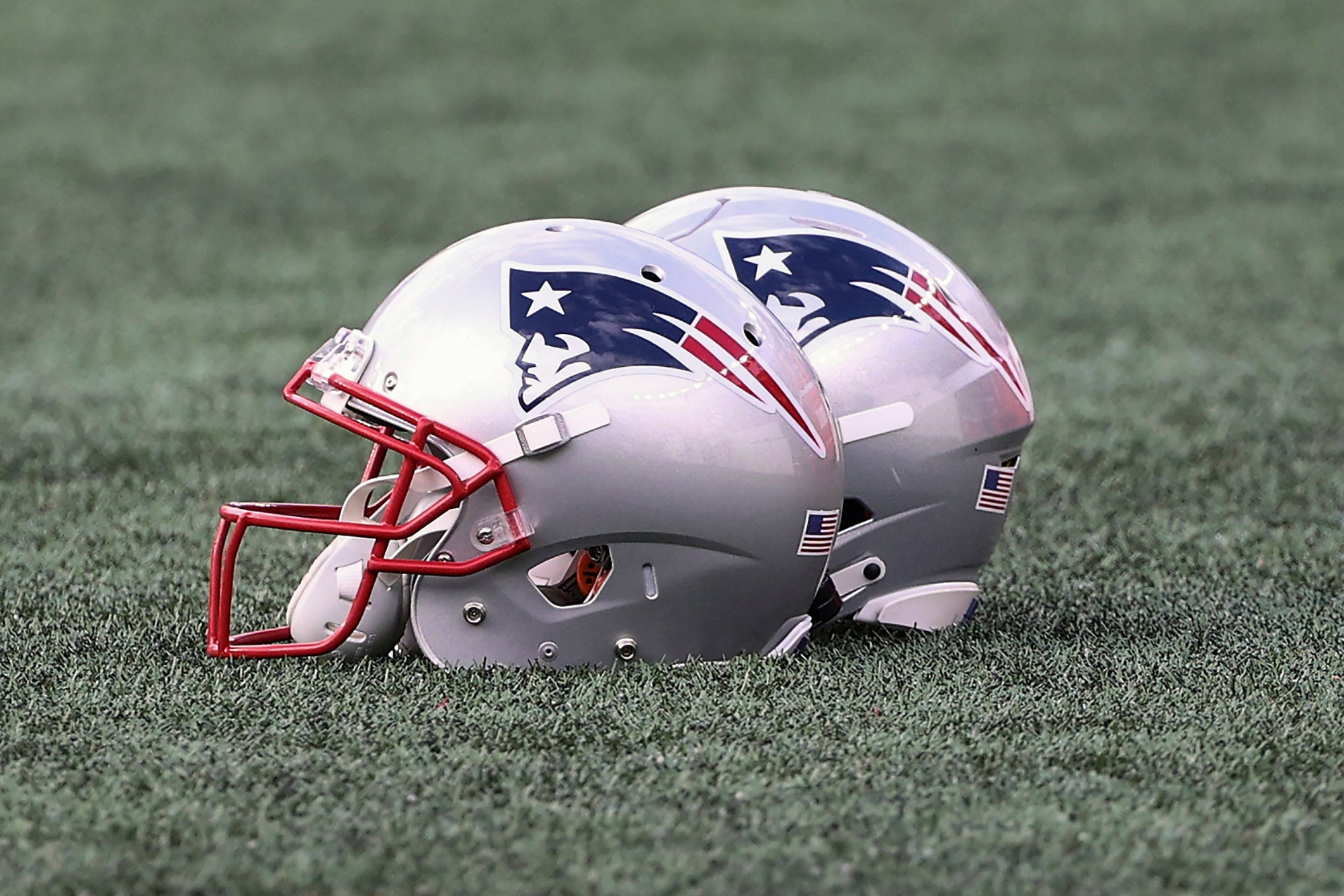 The New England Patriots logo is seen on helmets before the NFL football game between the New England Patriots and the Dallas Cowboys at Gillette Stadium, Sunday, Oct. 17, 2021 in Foxborough, Mass.