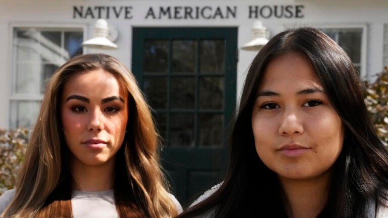 Dartmouth College students Marisa Joseph, right, a member of the Tulalip Tribes of Washington, poses with Ahnili Johnson-Jennings, left, a member of the Quapaw, Choctaw, Sac and Fox and Miami tribes, pose outside the Native American House at Dartmouth College, Friday, April 7, 2023, in Hanover, N.H.