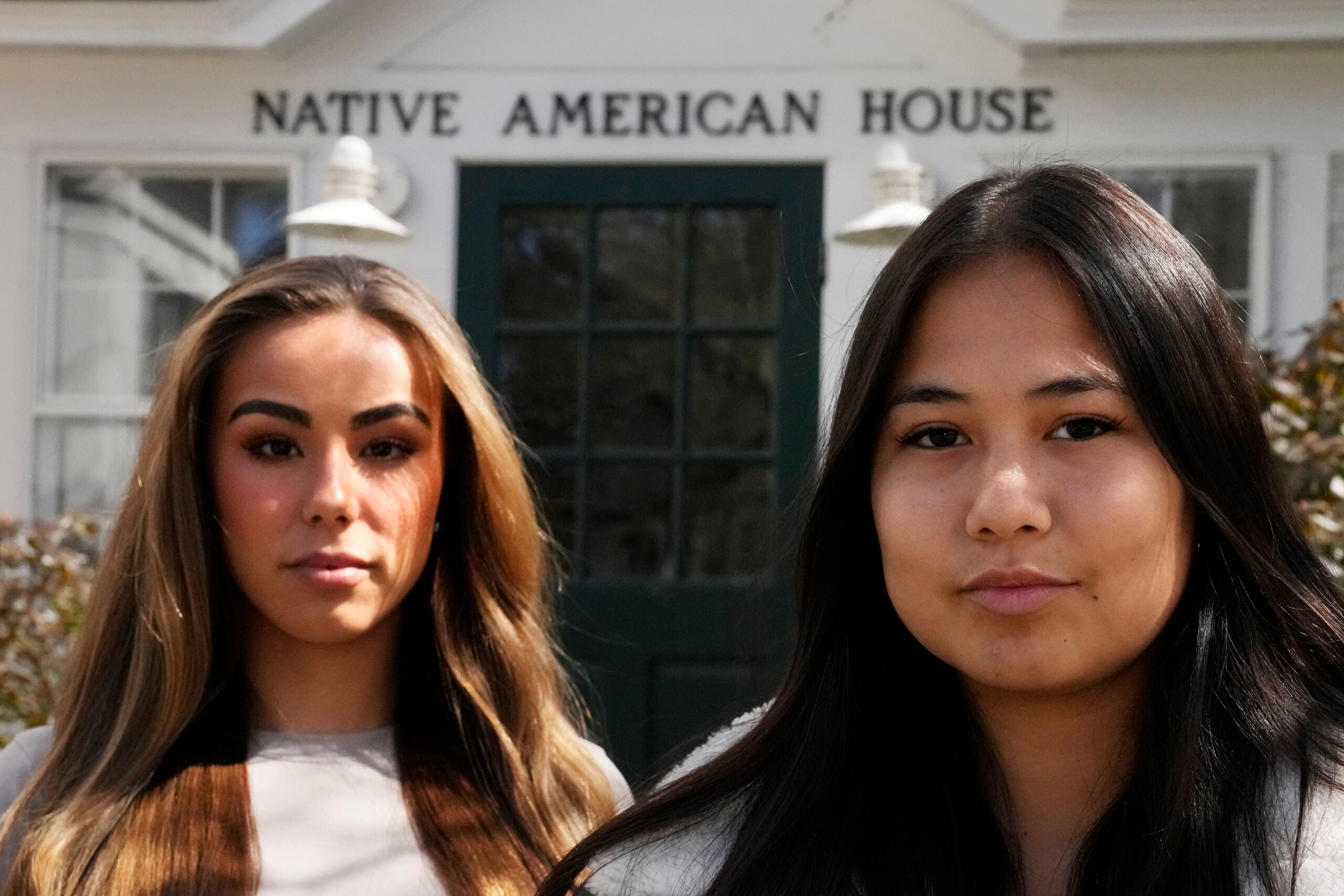 Dartmouth College students Marisa Joseph, right, a member of the Tulalip Tribes of Washington, poses with Ahnili Johnson-Jennings, left, a member of the Quapaw, Choctaw, Sac and Fox and Miami tribes, pose outside the Native American House at Dartmouth College, Friday, April 7, 2023, in Hanover, N.H.