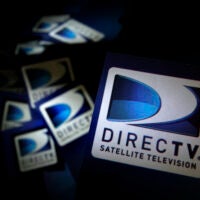 DirecTV logos are seen on flyers in North Andover, Mass.
