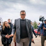 Rep. George Santos, R-N.Y., leaves a House GOP conference meeting on Capitol Hill in Washington.