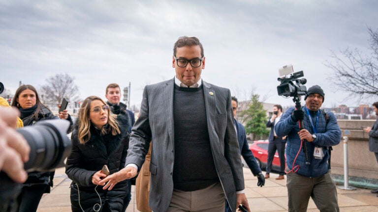 Rep. George Santos, R-N.Y., leaves a House GOP conference meeting on Capitol Hill in Washington.