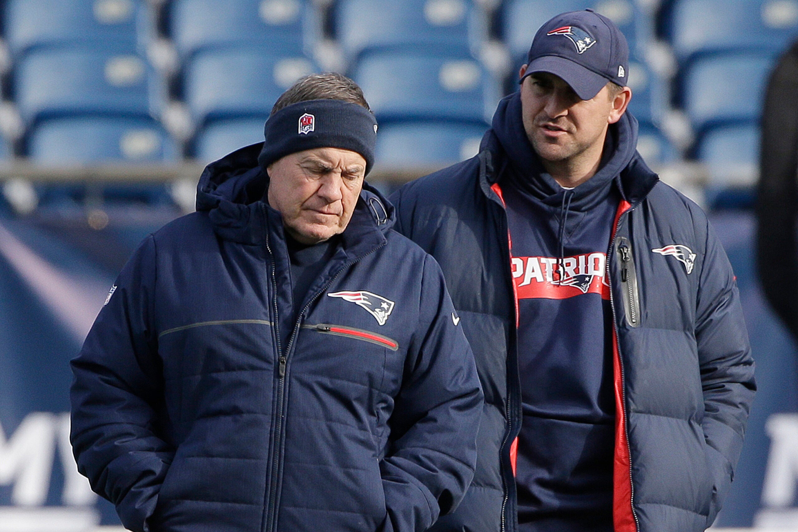 In this Dec. 20, 2018, file photo, New England Patriots head coach Bill Belichick, left, speaks with special teams coach Joe Judge, right, during NFL football practice in Foxborough, Mass.