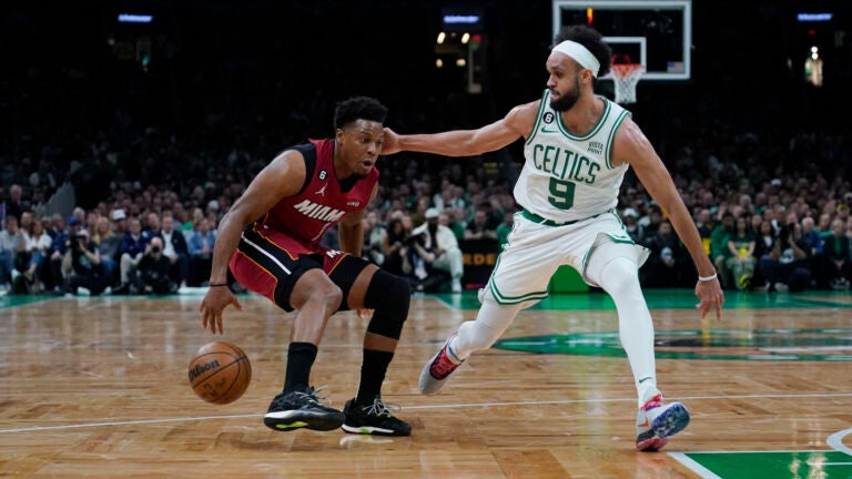 Miami Heat guard Kyle Lowry (7) drives to the basket against Boston Celtics guard Derrick White (9) in the first half of Game 1 of the NBA basketball Eastern Conference finals playoff series in Boston, Wednesday, May 17, 2023.