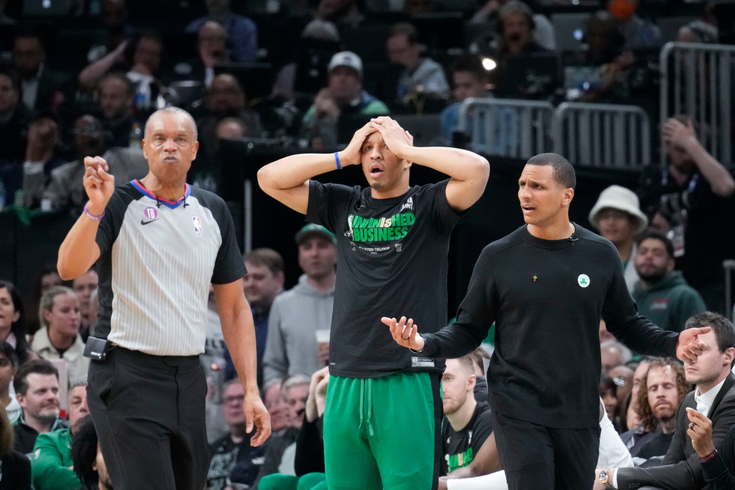 Boston Celtics head coach Joe Mazzulla argues with referee Rodney Mott in the second half of Game 1 of the NBA basketball Eastern Conference finals playoff series in Boston, Wednesday, May 17, 2023. Center is forward Grant Williams.