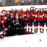 The Florida Panthers pose with the Prince of Wales trophy after winning Game 4 of the NHL hockey Stanley Cup Eastern Conference finals against the Carolina Hurricanes.