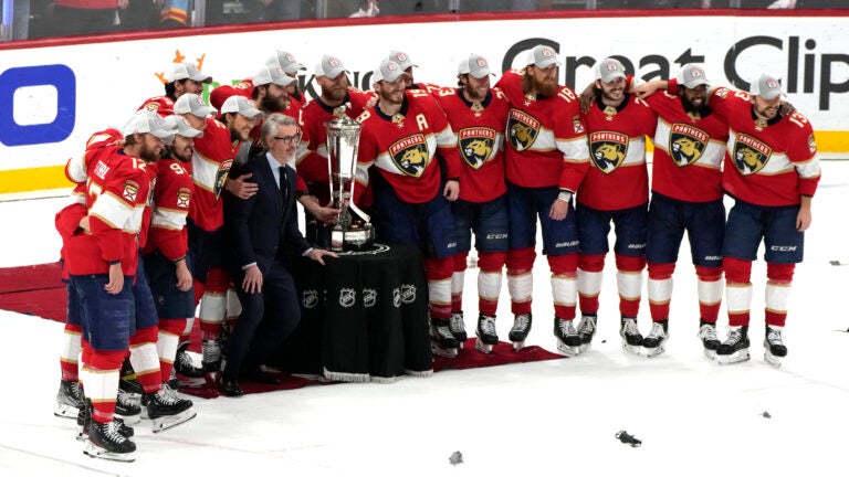 The Florida Panthers pose with the Prince of Wales trophy after winning Game 4 of the NHL hockey Stanley Cup Eastern Conference finals against the Carolina Hurricanes.
