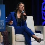 Aly Raisman speaks at The Massachusets Conference For Women at the Boston Convention Center in 2018.