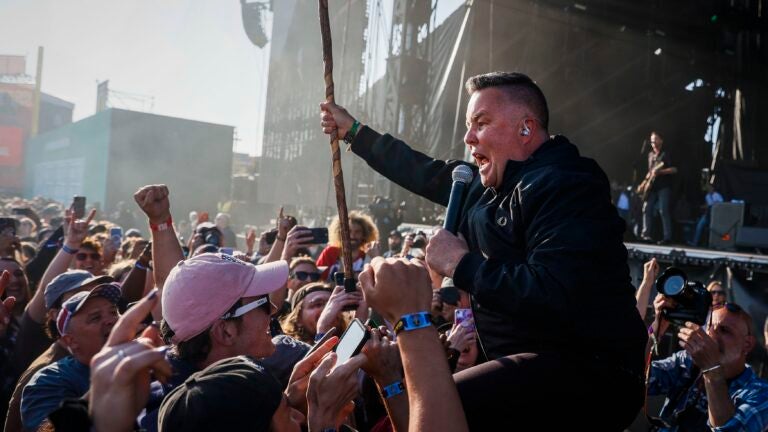 Ken Casey of the Dropkick Murphys wades into the crowd at Boston Calling 2023 on Friday.